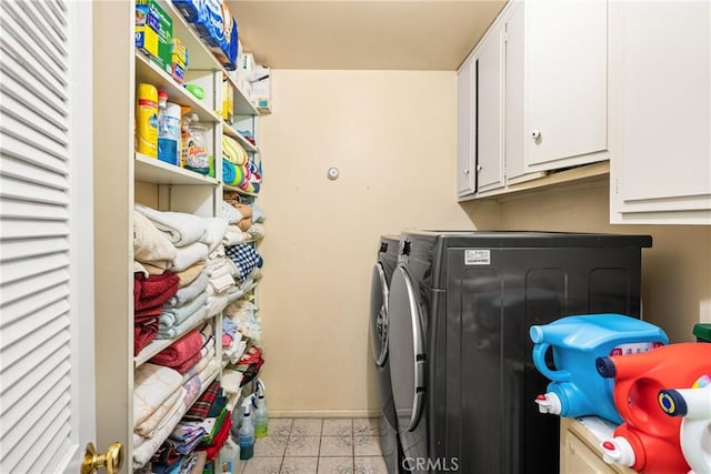 9492 Brynmar Dr, Villa Park, CA 92861 - clothes washing area featuring washing machine and clothes dryer, cabinet space, baseboards, and light tile patterned flooring