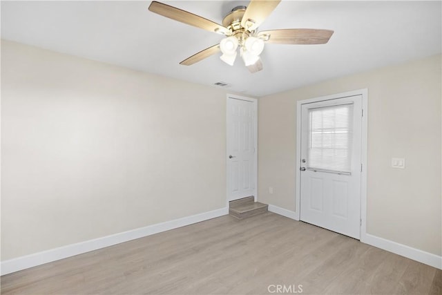 23821 Norma Dr, Menifee, CA 92587 - spare room with baseboards, light wood finished floors, and a ceiling fan