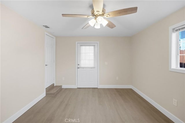 23821 Norma Dr, Menifee, CA 92587 - spare room with light wood-style floors, baseboards, and a ceiling fan