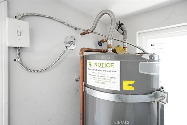 23821 Norma Dr, Menifee, CA 92587 - utility room with strapped water heater