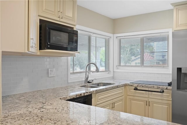 23821 Norma Dr, Menifee, CA 92587 - kitchen with a sink, black appliances, healthy amount of natural light, and backsplash