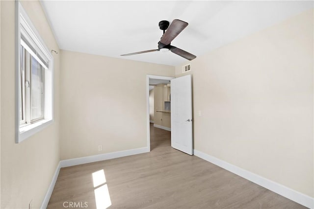 23821 Norma Dr, Menifee, CA 92587 - unfurnished bedroom featuring wood finished floors, baseboards, and ceiling fan