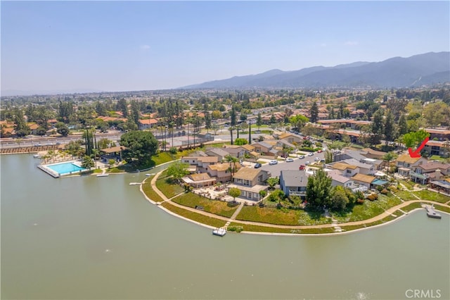 birds eye view of property featuring a water and mountain view