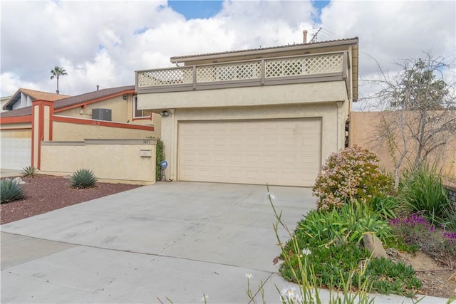view of front of house featuring fence, driveway, a garage, stucco siding, and central AC unit