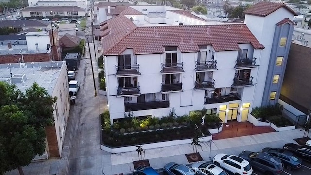 view of property with uncovered parking