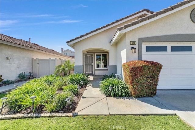 976 Miraflores Dr, Corona, CA 92882 - property entrance featuring stucco siding and an attached garage