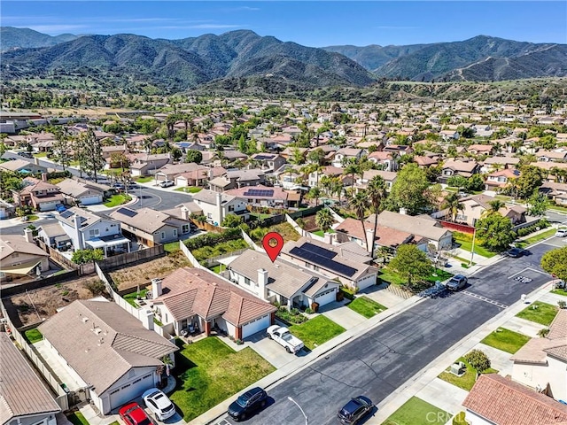 birds eye view of property featuring a mountain view and a residential view