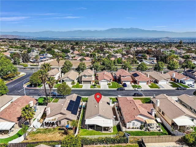 birds eye view of property featuring a mountain view and a residential view