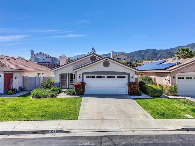 976 Miraflores Dr, Corona, CA 92882 - view of front of property featuring an attached garage, stucco siding, driveway, and a mountain view