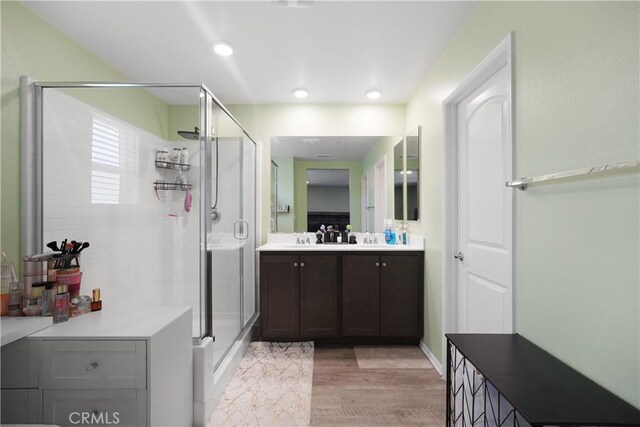 26643 Baneberry Ct, Menifee, CA 92585 - full bath featuring a shower stall, wood finished floors, vanity, and baseboards