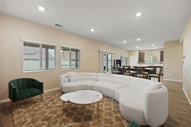 26643 Baneberry Ct, Menifee, CA 92585 - living area featuring baseboards, recessed lighting, and wood finished floors