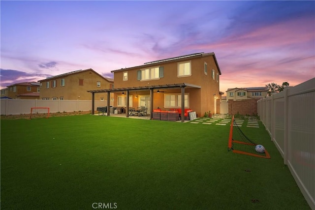 26643 Baneberry Ct, Menifee, CA 92585 - back of property at dusk featuring a patio, stucco siding, and an outdoor hangout area