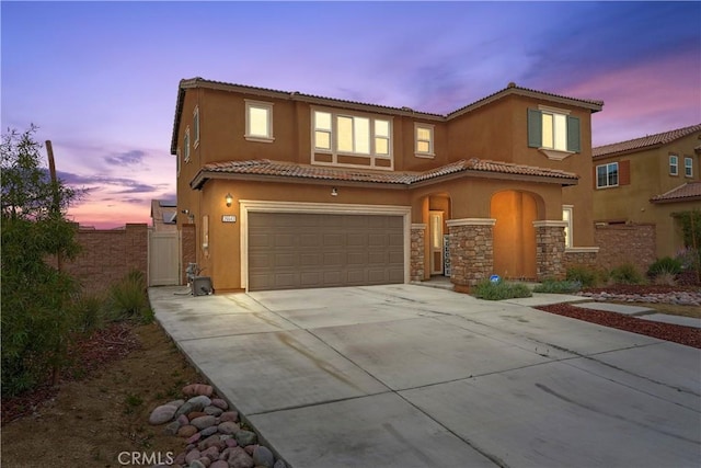26643 Baneberry Ct, Menifee, CA 92585 - view of front of property featuring an attached garage, driveway, a tiled roof, stucco siding, and fence