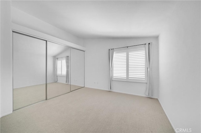 8 Tamarac Pl, Aliso Viejo, CA 92656 - unfurnished bedroom featuring carpet, a closet, and lofted ceiling