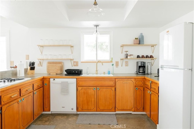 kitchen with white appliances, open shelves, a sink, light countertops, and brown cabinets