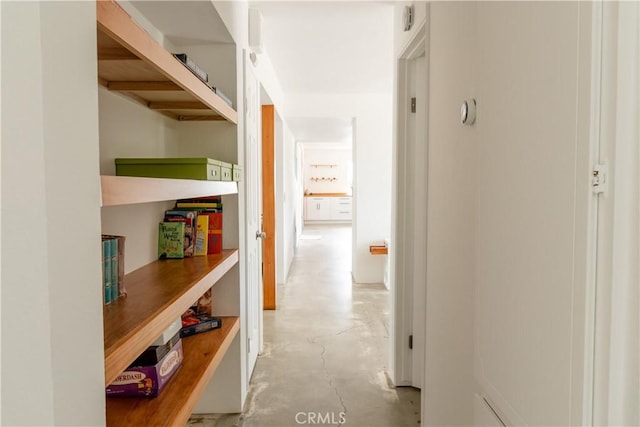 corridor with concrete floors