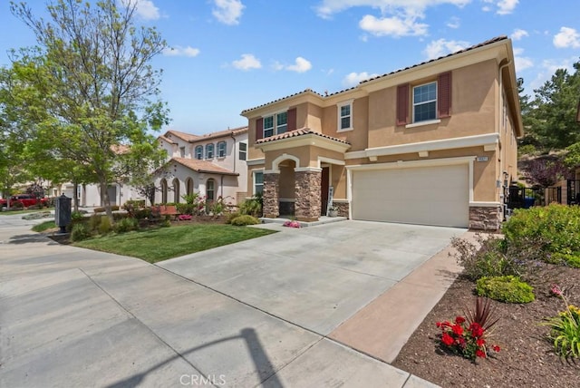 19321 Carranza Ln, Saugus, CA 91350 - mediterranean / spanish house featuring stone siding, stucco siding, concrete driveway, an attached garage, and a tiled roof
