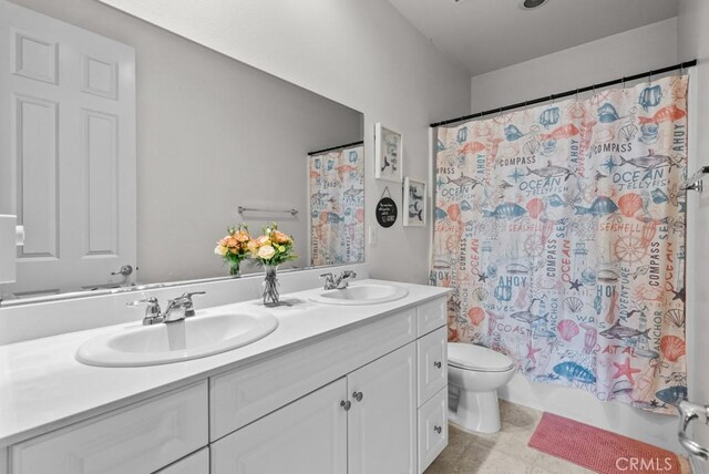 19321 Carranza Ln, Saugus, CA 91350 - full bathroom featuring toilet, double vanity, and shower / tub combo