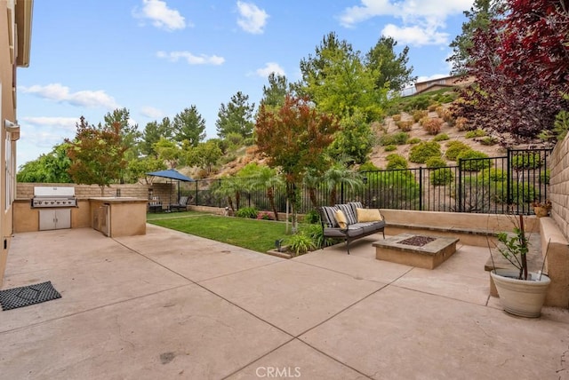 19321 Carranza Ln, Saugus, CA 91350 - view of patio / terrace featuring an outdoor fire pit, a grill, an outdoor kitchen, and a fenced backyard