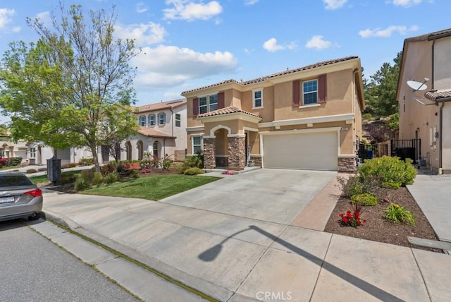 19321 Carranza Ln, Saugus, CA 91350 - mediterranean / spanish-style house with stone siding, an attached garage, stucco siding, a tile roof, and driveway