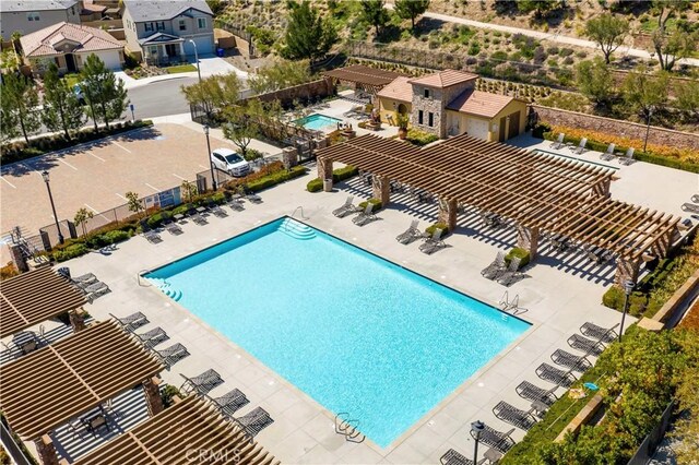 19321 Carranza Ln, Saugus, CA 91350 - community pool with fence, a pergola, and a patio area