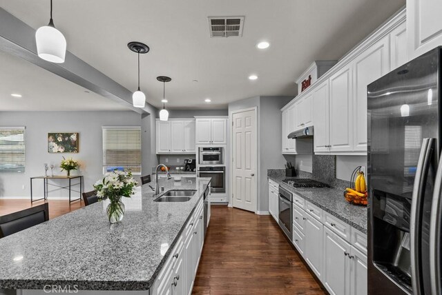 19321 Carranza Ln, Saugus, CA 91350 - kitchen featuring appliances with stainless steel finishes, a sink, baseboards, recessed lighting, and a kitchen island with sink