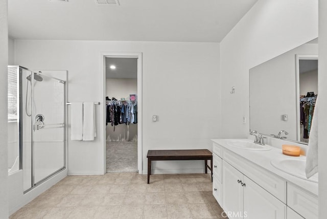 19321 Carranza Ln, Saugus, CA 91350 - full bath with a stall shower, a spacious closet, double vanity, and a sink