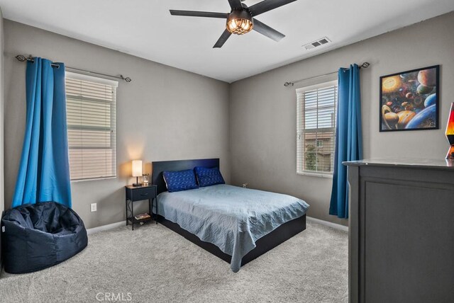 19321 Carranza Ln, Saugus, CA 91350 - carpeted bedroom with baseboards, visible vents, and a ceiling fan