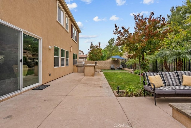 19321 Carranza Ln, Saugus, CA 91350 - view of patio / terrace featuring fence and an outdoor kitchen