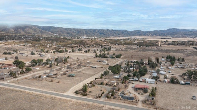 bird's eye view featuring a rural view, view of desert, and a mountain view