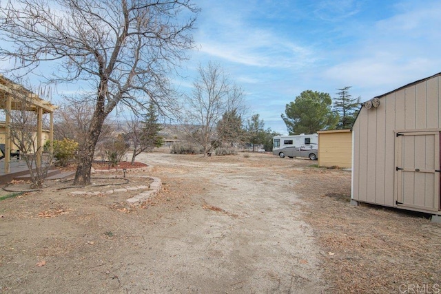 view of street featuring dirt driveway