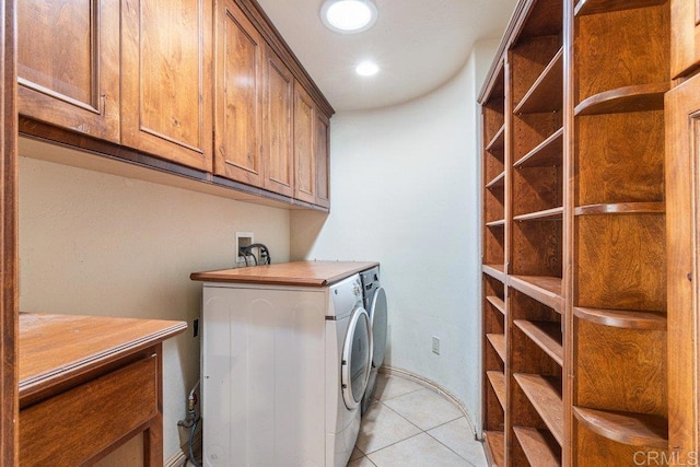 laundry room featuring cabinet space, washing machine and dryer, light tile patterned floors, and recessed lighting