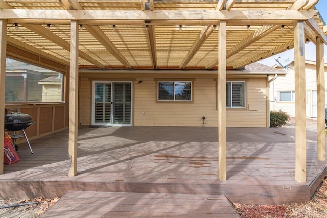 exterior space featuring a pergola and a grill