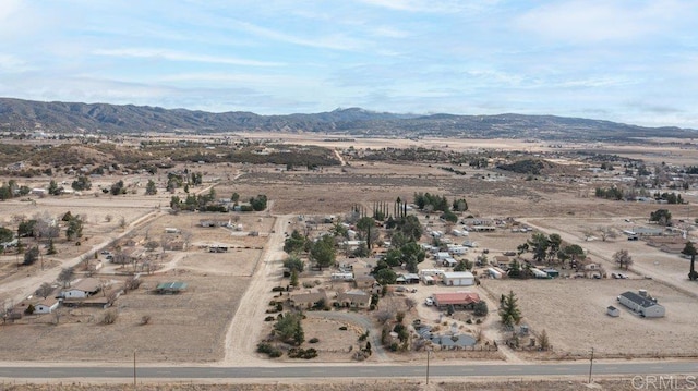 aerial view with a mountain view, a rural view, and view of desert