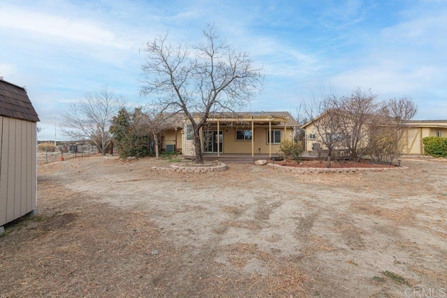 back of house featuring covered porch