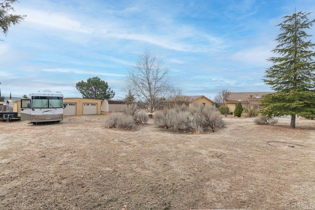 view of yard featuring a garage