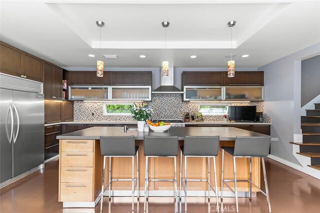 291 Argonne Ave, Long Beach, CA 90803 - kitchen with stainless steel built in refrigerator, backsplash, recessed lighting, a raised ceiling, and wall chimney range hood