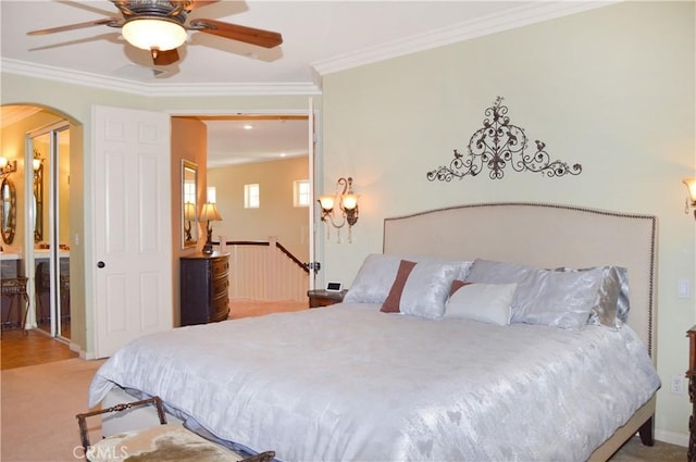 13622 Canyon Crest Rd, Yucaipa, CA 92399 - carpeted bedroom featuring arched walkways, crown molding, ceiling fan, and baseboards