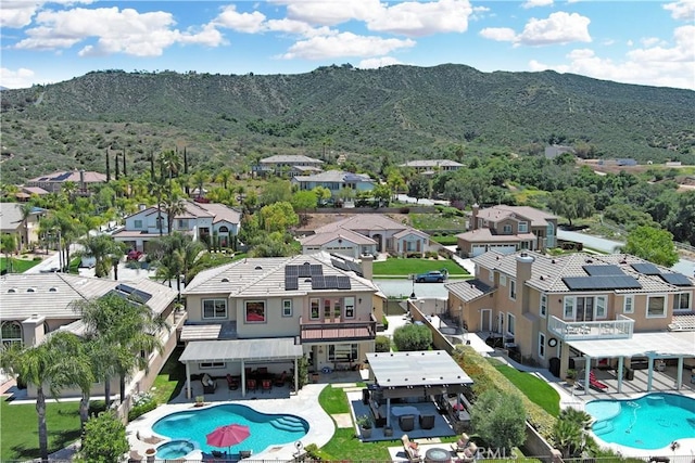 13622 Canyon Crest Rd, Yucaipa, CA 92399 - aerial perspective of suburban area with a pool area and mountains
