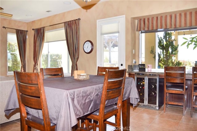13622 Canyon Crest Rd, Yucaipa, CA 92399 - dining space featuring wine cooler and light tile patterned floors