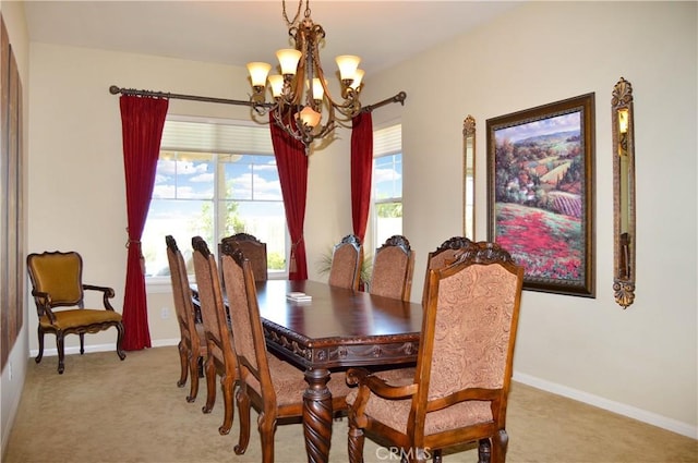 13622 Canyon Crest Rd, Yucaipa, CA 92399 - dining area featuring a chandelier, light colored carpet, and baseboards