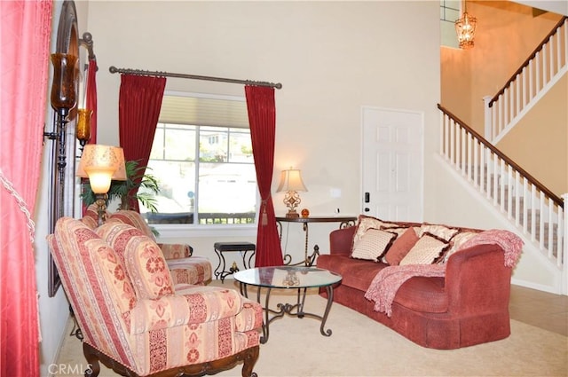 13622 Canyon Crest Rd, Yucaipa, CA 92399 - living room featuring stairway and a high ceiling
