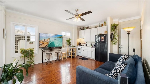 140 Linden Ave Unit 962, Long Beach, CA 90802 - living room featuring dark wood-style flooring, crown molding, and ceiling fan