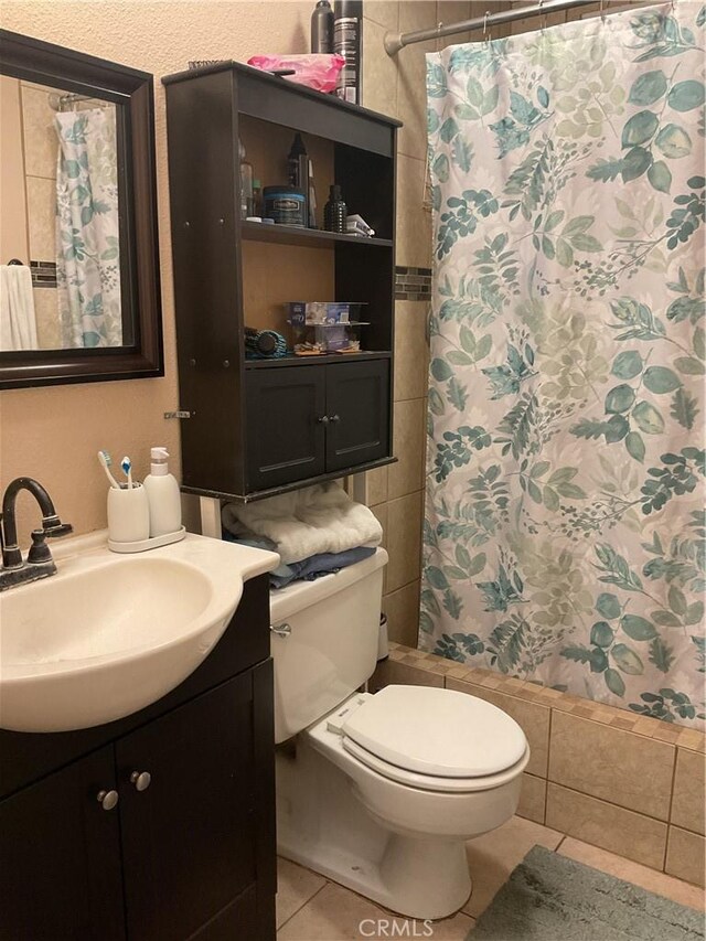 322 N Fillmore Ave, Rialto, CA 92376 - bathroom featuring tile patterned floors and vanity