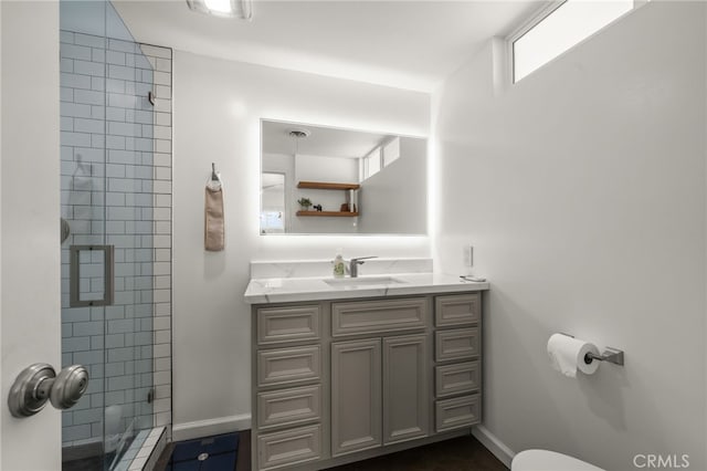 19542 Constellation Ln, Huntington Beach, CA 92646 - bathroom featuring a stall shower, baseboards, and vanity