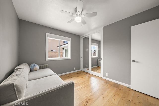 19542 Constellation Ln, Huntington Beach, CA 92646 - living room featuring baseboards, a ceiling fan, and wood-type flooring