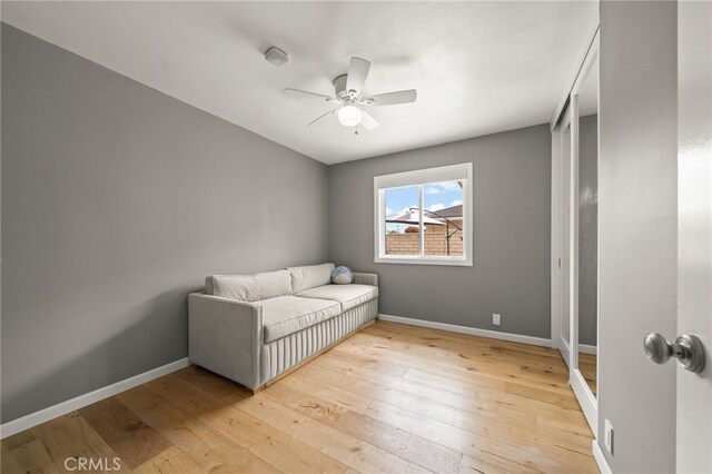 19542 Constellation Ln, Huntington Beach, CA 92646 - living area with baseboards, light wood-style flooring, and ceiling fan