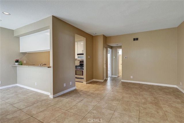 4560 Cleveland Ave Unit 101, San Diego, CA 92116 - empty room featuring light tile patterned flooring, recessed lighting, and baseboards