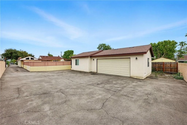 garage with fence