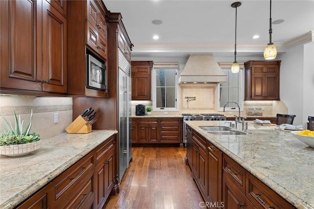 kitchen featuring custom range hood, a sink, stainless steel appliances, tasteful backsplash, and ornamental molding